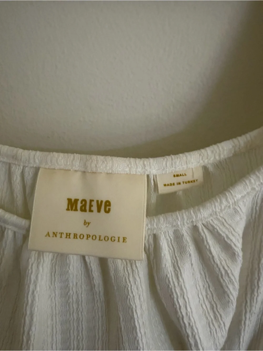 Anthropologie Cream Puff-Sleeve Smocked Peplum Top